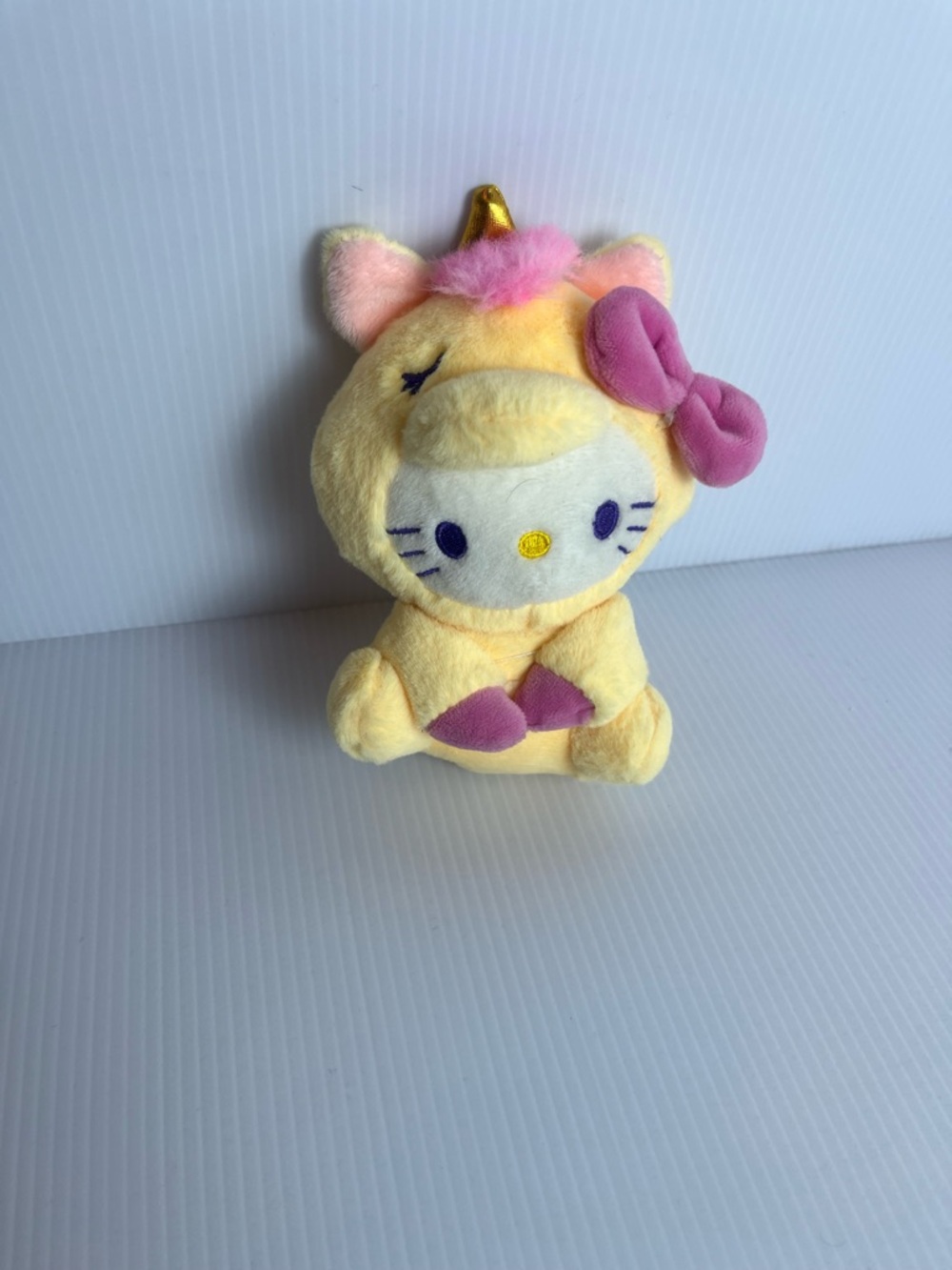 Hello kitty plushie stuffed animal in unicorn costume
